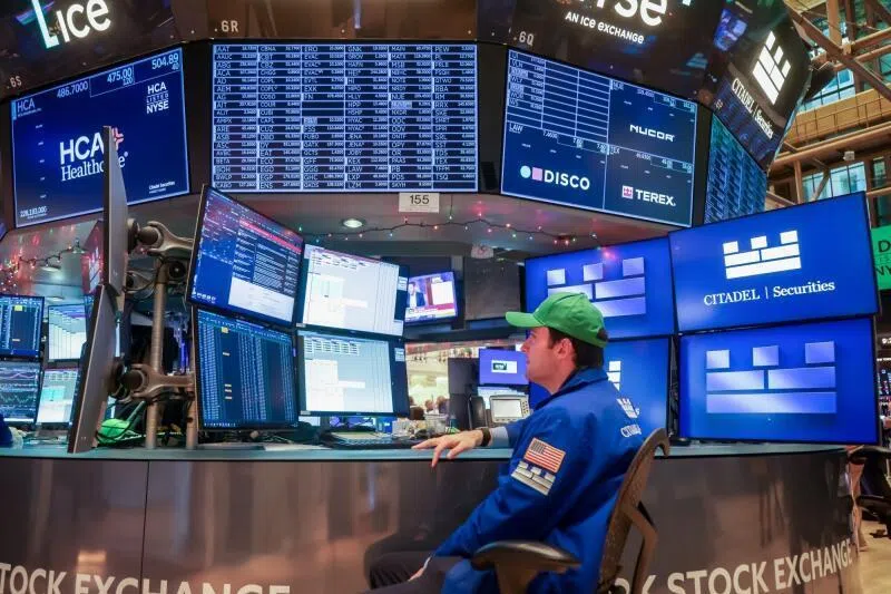 A trader works on the floor of the New York Stock Exchange in New York on Dec 8.