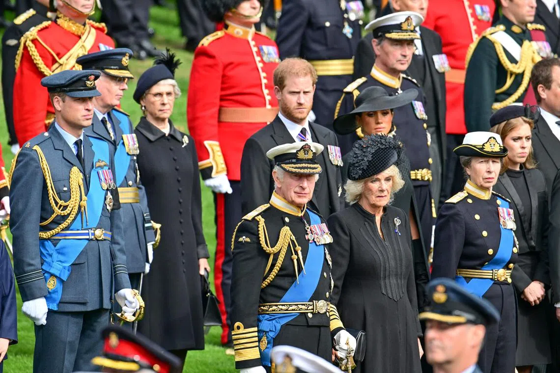 Members of Britain's royal family observe as the coffin of Queen Elizabeth is transferred from the gun carriage to the hearse at Wellington Arch in London, on Sept 19, 2022.