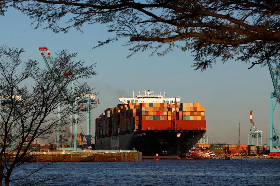 FILE PHOTO: A cargo ship sits outside of the Port of Elizabeth marine terminal seen from Bayonne, New Jersey, U.S., April 9 2025. REUTERS/Shannon Stapleton/File Photo