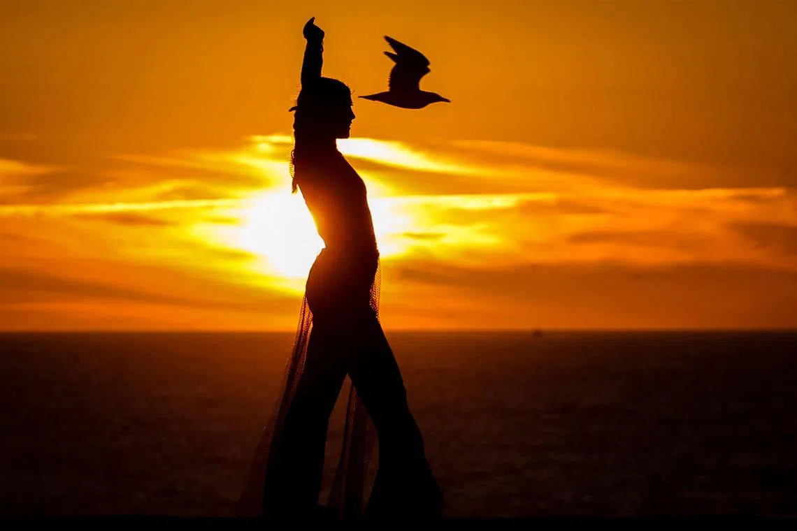 A dancer performing on the eve of International Women's Day during the World Women's Forum for Peace at the historic fortifications of the port of Essaouira on Morocco's Atlantic coast on March 7, 2023. 
