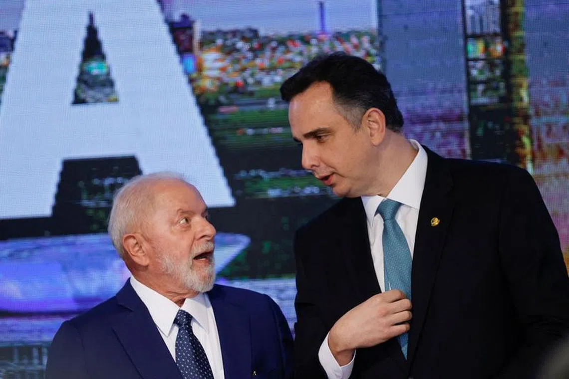 Brazil's President Luiz Inacio Lula da Silva talks with Brazil's Senate President Rodrigo Pacheco during an event to mark the consolidation of democracy in Brazil, a year after supporters of far-right former President Jair Bolsonaro stormed the presidential palace, Congress and Supreme Court, in Brasilia, Brazil January 8, 2024. REUTERS/Adriano Machado/ File Photo