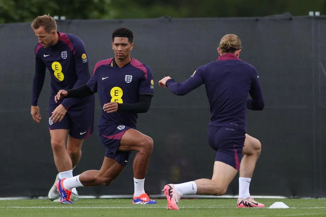 England's midfielder Jude Bellingham (centre) taking part in a training session ahead of Euro 2024.