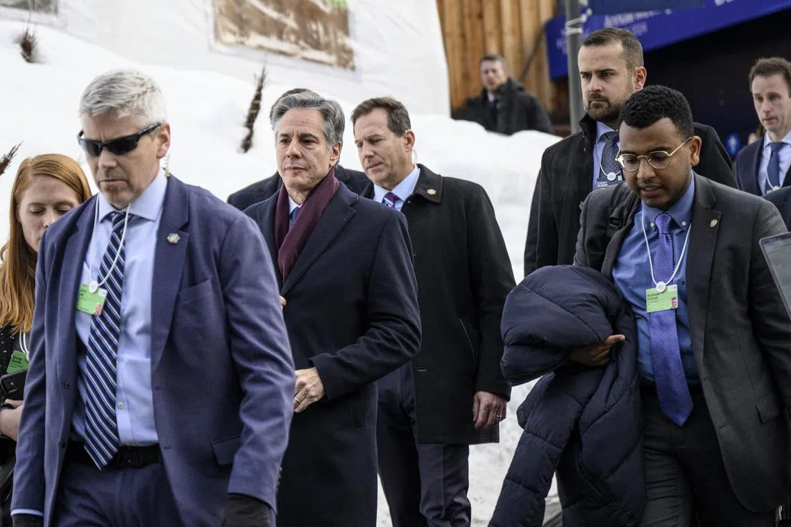US Secretary of State Antony Blinken (centre left) leaves the Congress Centre after his speech at the World Economic Forum, in Davos, Switzerland.