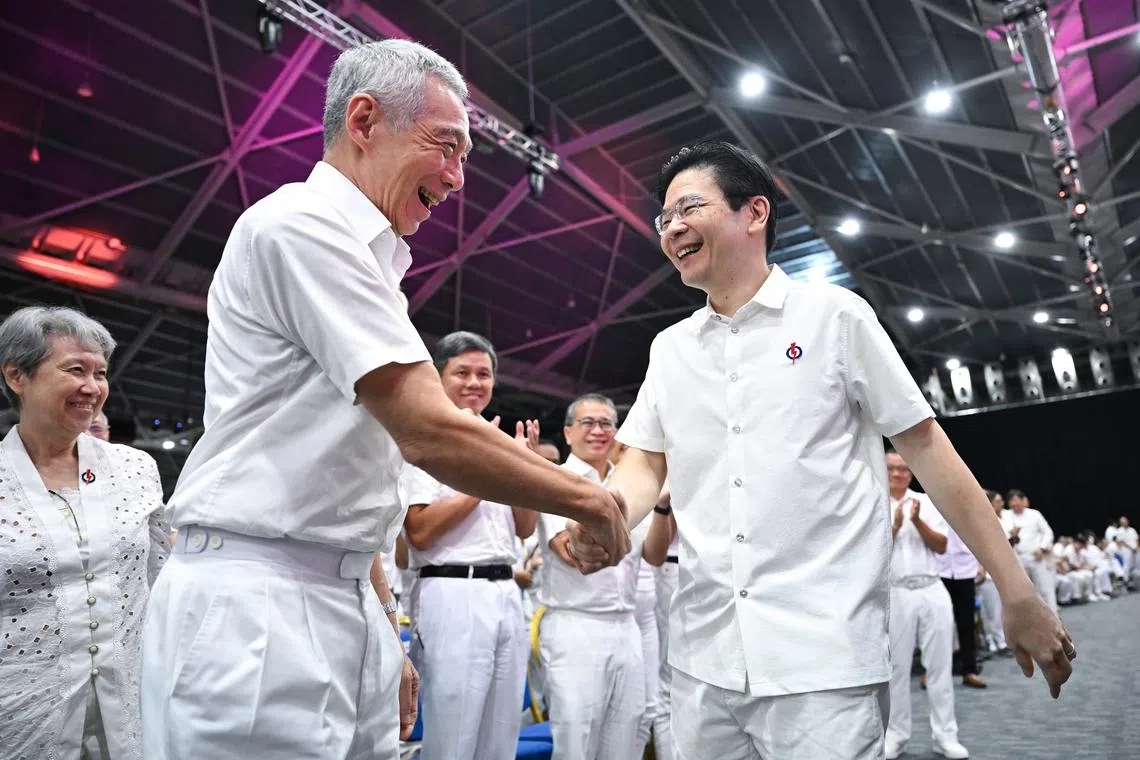 Senior Minister Lee Hsien Loong (left) with Prime Minister Lawrence Wong at the PAP conference on Nov 24.