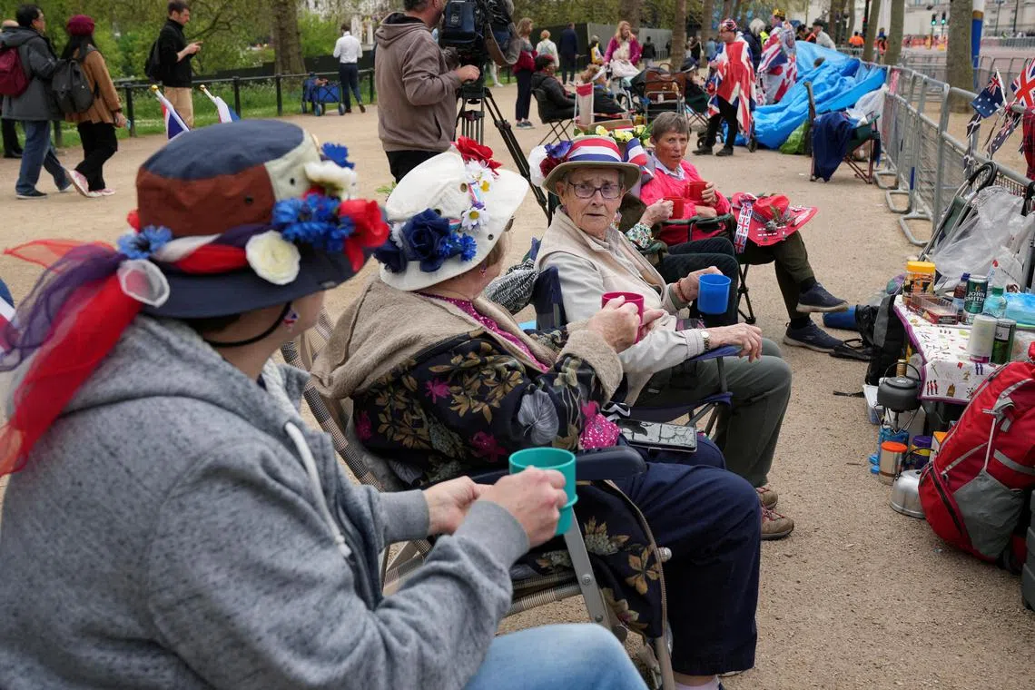 Elizabeth Couzens, 58, Shirley Messinger, 76, Eunice Hartstone, 79, Margaret Tinsley, 81, and Jessie Young, 81, lock down their coronation viewing spot in London.