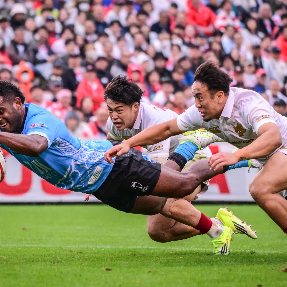 Fiji’s Tuidraki Samusamuvodre scores a try during an international test match between Japan and Fiji at the Prince Chichibu Memorial Rugby Ground in Tokyo on Oct 24.