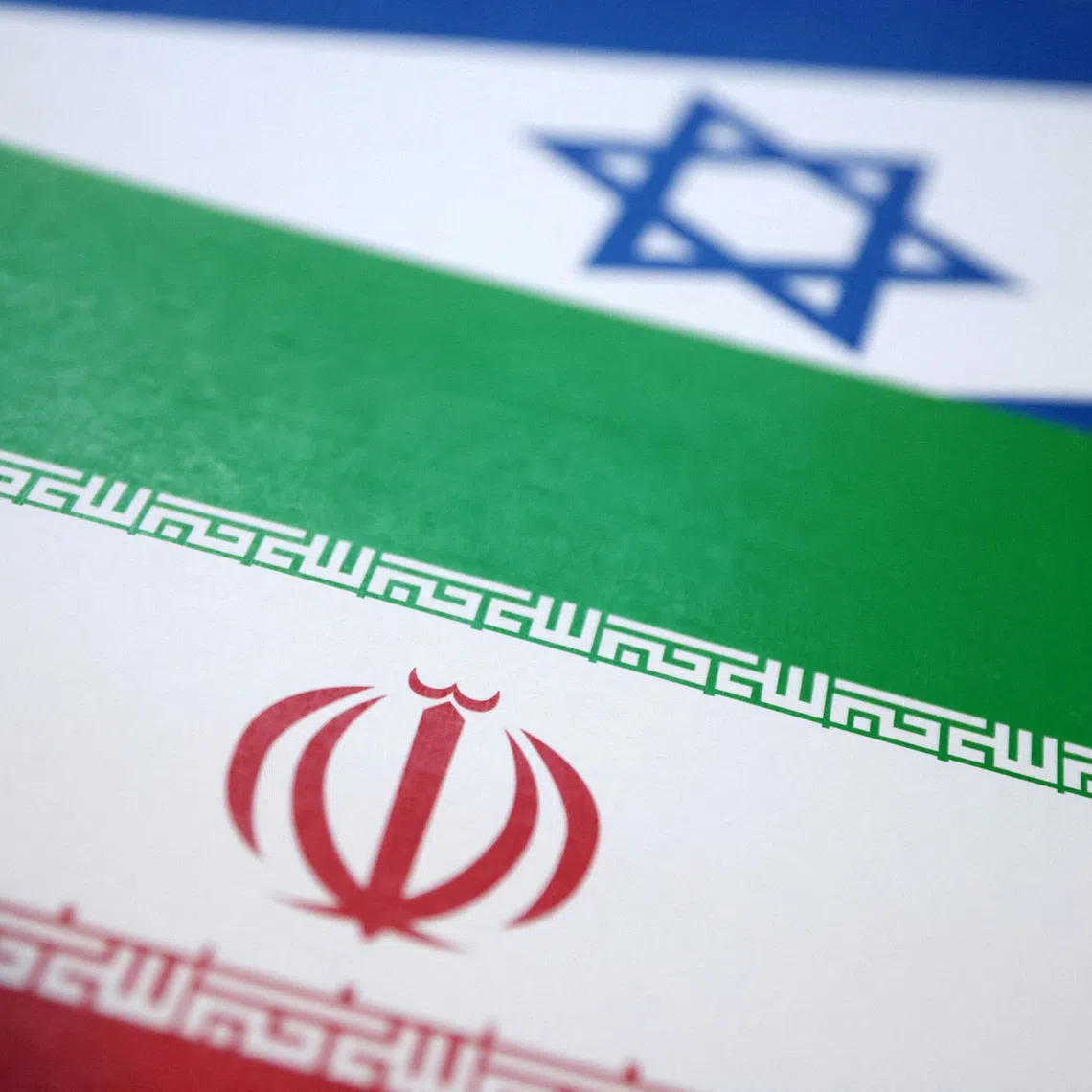 FILE PHOTO: Israel and Iran flags are seen in this illustration taken June 18, 2025. REUTERS/Dado Ruvic/Illustration/File Photo