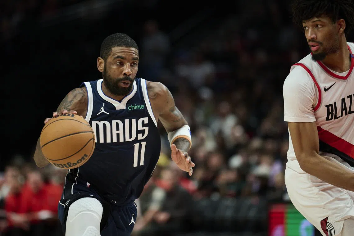 Dec 28, 2024; Portland, Oregon, USA; Dallas Mavericks guard Kyrie Irving (11) drives to the basket during the first half against Portland Trail Blazers guard Shaedon Sharpe (17) at Moda Center. Mandatory Credit: Troy Wayrynen-Imagn Images/ File Photo