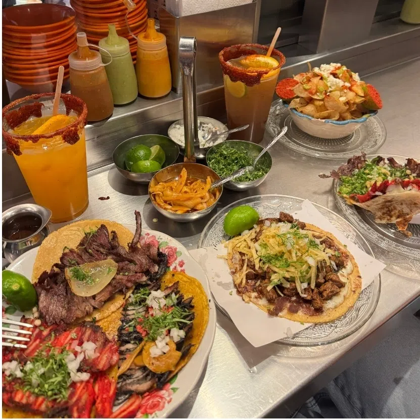 Tacos del Valle (left), serving freshly pressed tortillas and vibrant salsas. The courtyard of Museo Frida Kahlo (right) bursting with tropical greenery, all set against the iconic cobalt-blue walls.