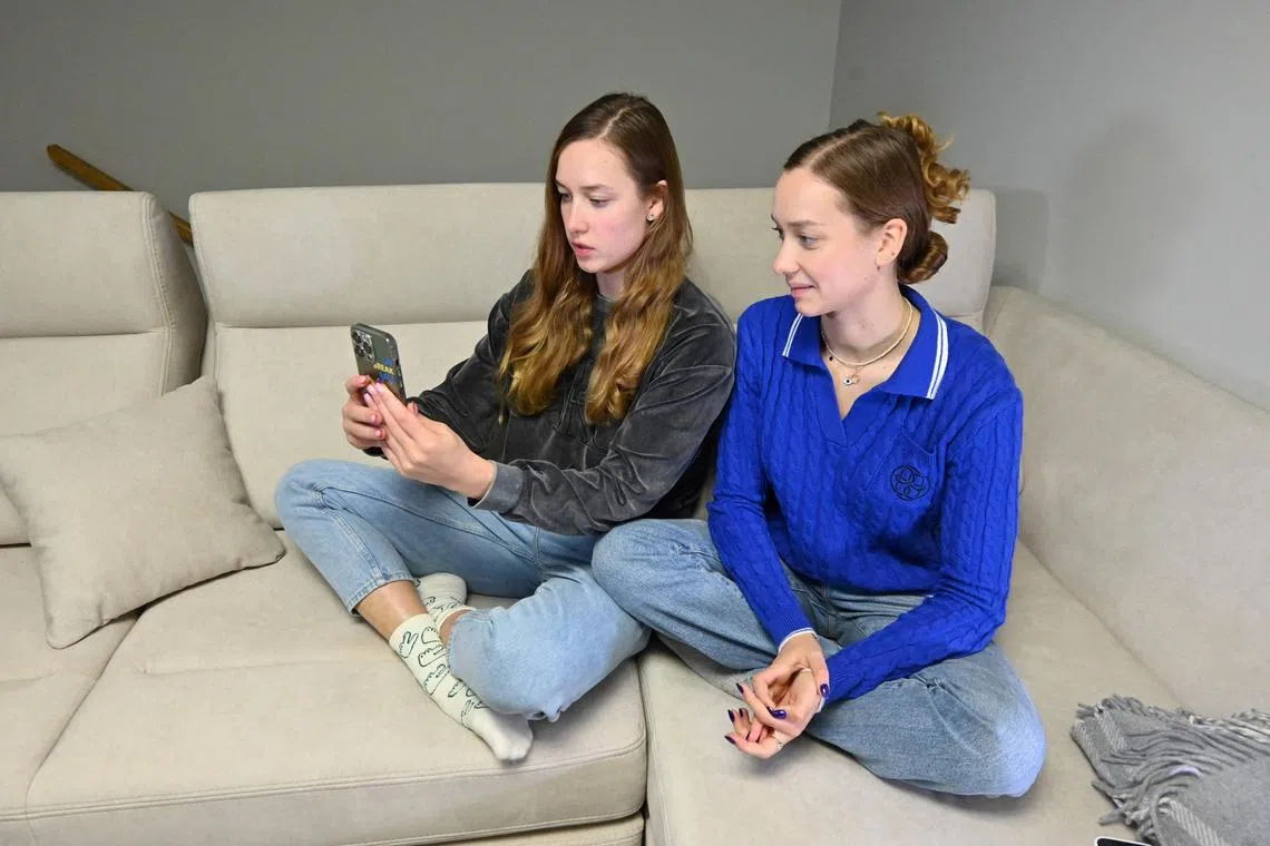 Ukraine's Maryna (left) and Vladyslava Aleksiiva in Maryna's apartment in Kharkiv, on Oct 29, 2023. 