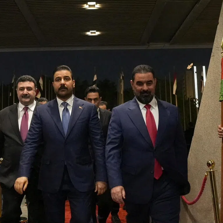 Speaker of Iraq's Parliament Haibat al-Halbousi welcomes Prime Minister Ali al-Zaidi at the parliament building ahead of a session to approve the remaining members of his cabinet, in Baghdad, Iraq, October 15, 2026. Iraqi Prime Minister's Media Office/Handout via REUTERS