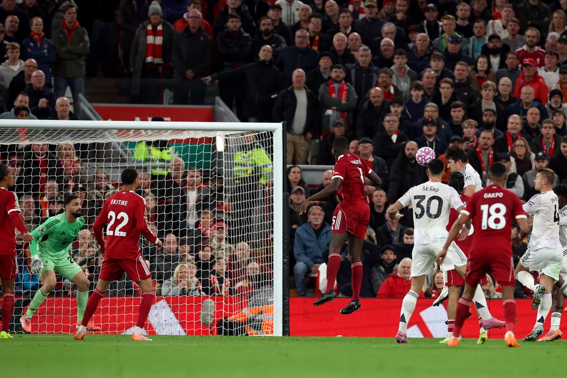 Soccer Football - Premier League - Liverpool v Manchester United - Anfield, Liverpool, Britain - October 19, 2025 Manchester United's Harry Maguire scores their second goal REUTERS/Phil Noble