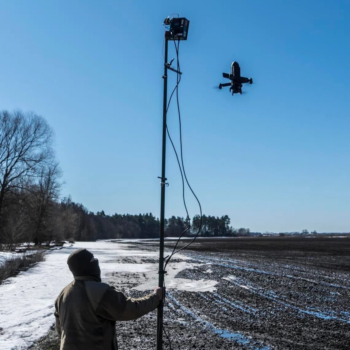A Ukrainian instructor demonstrates operations for the Bullet, an interceptor drone designed to counter Shahed-style drones, near Kyiv, on March 11.