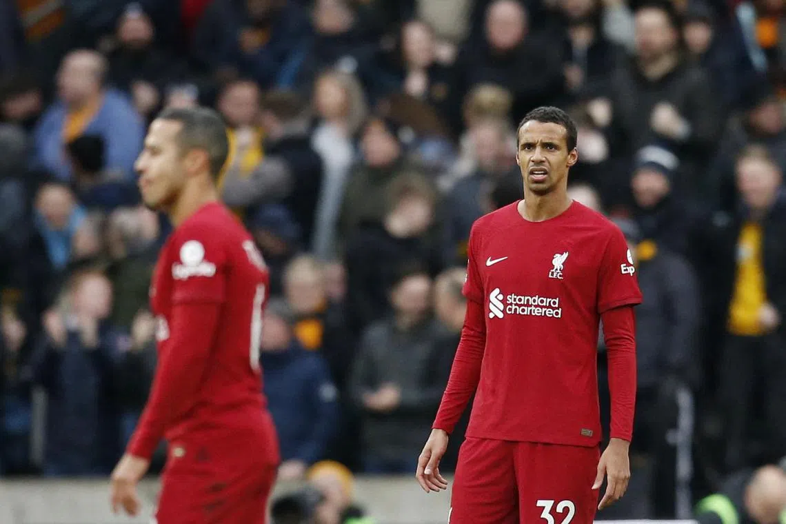 Liverpool's Joel Matip looks dejected after Wolverhampton Wanderers' Craig Dawson scores their second goal.