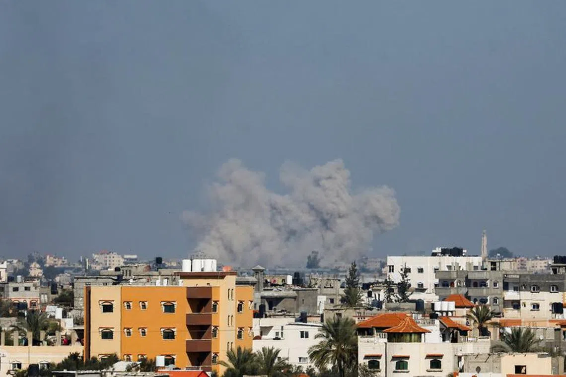 Smoke rises following Israeli strikes, amid the ongoing conflict between Israel and the Palestinian Islamist group Hamas, as seen from Rafah, in the southern Gaza Strip, January 18, 2024. REUTERS/Ibraheem Abu Mustafa