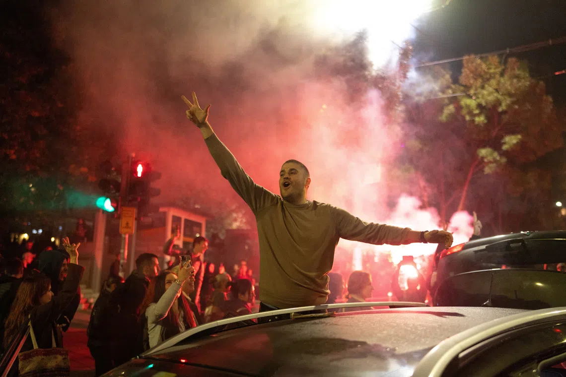 Supporters of the electoral list \"Student List - Students Win\" celebrate after Aleksandar Vucic, Serbian Progressive Party (SNS) prime ministerial candidate, conceded defeat in the parliamentary election in Belgrade, Serbia, October 26, 2026. REUTERS/Uros Arsic