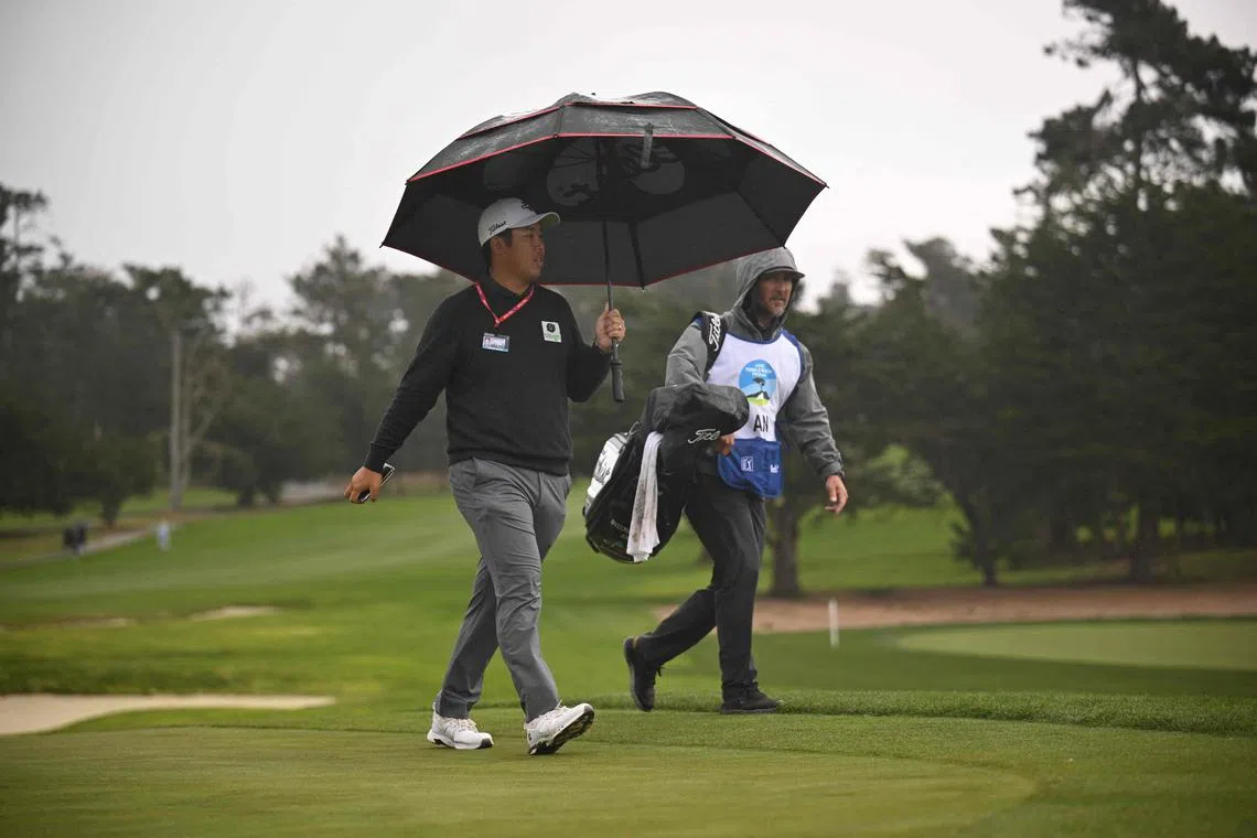 An Byeong Hun An of South Korea walking from the first hole after play was suspended due to high winds during the third round of the AT&T Pebble Beach Pro-Am at Spyglass Hill Golf Course on Saturday. 
