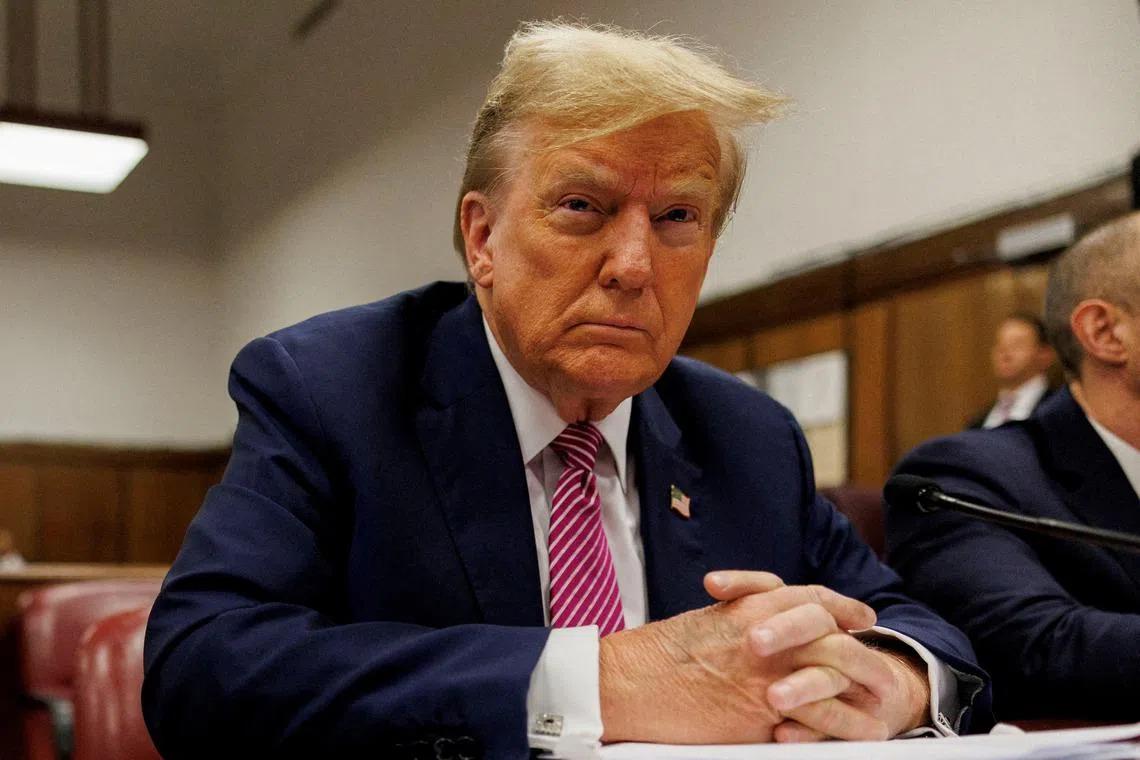 FILE PHOTO: Former U.S. President and current Republican presidential candidate Donald Trump sits at the defendant's table at Manhattan Criminal Court in New York, U.S., 19 April 2024. Sarah Yenesel/Pool via REUTERS/File Photo