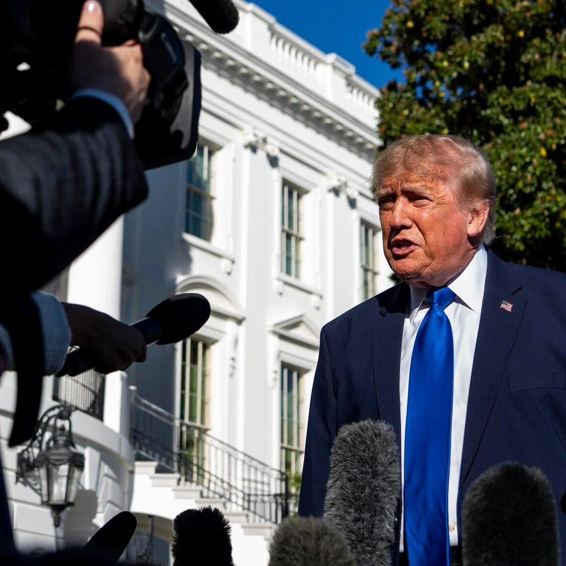US President Donald Trump speaking to the press before departing from the South Lawn of the White House on Oct 22 for a rally in Sioux City, Iowa.