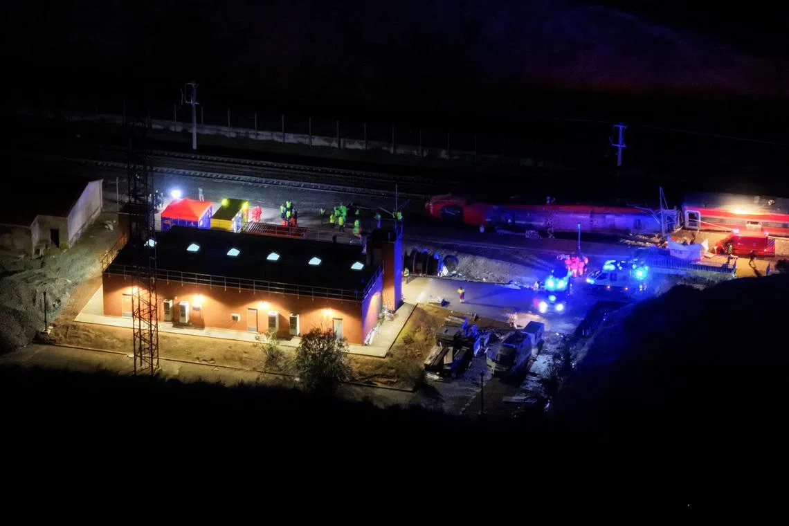 Spain deploys heavy machinery to find missing bodies among train crash wreckage