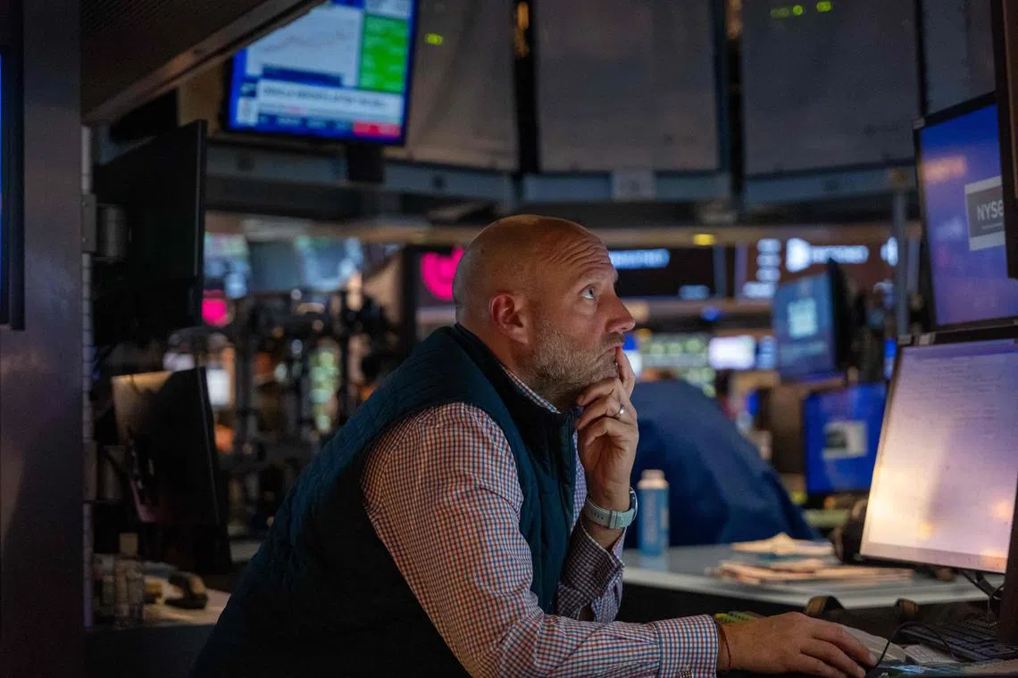 Traders work on the New York Stock Exchange floor, in New York City. 