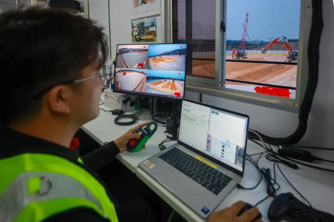 KTC project engineer Tosh Chin Kah Woo managing autonomous construction equipment from a control room during a trial on Sept 16.