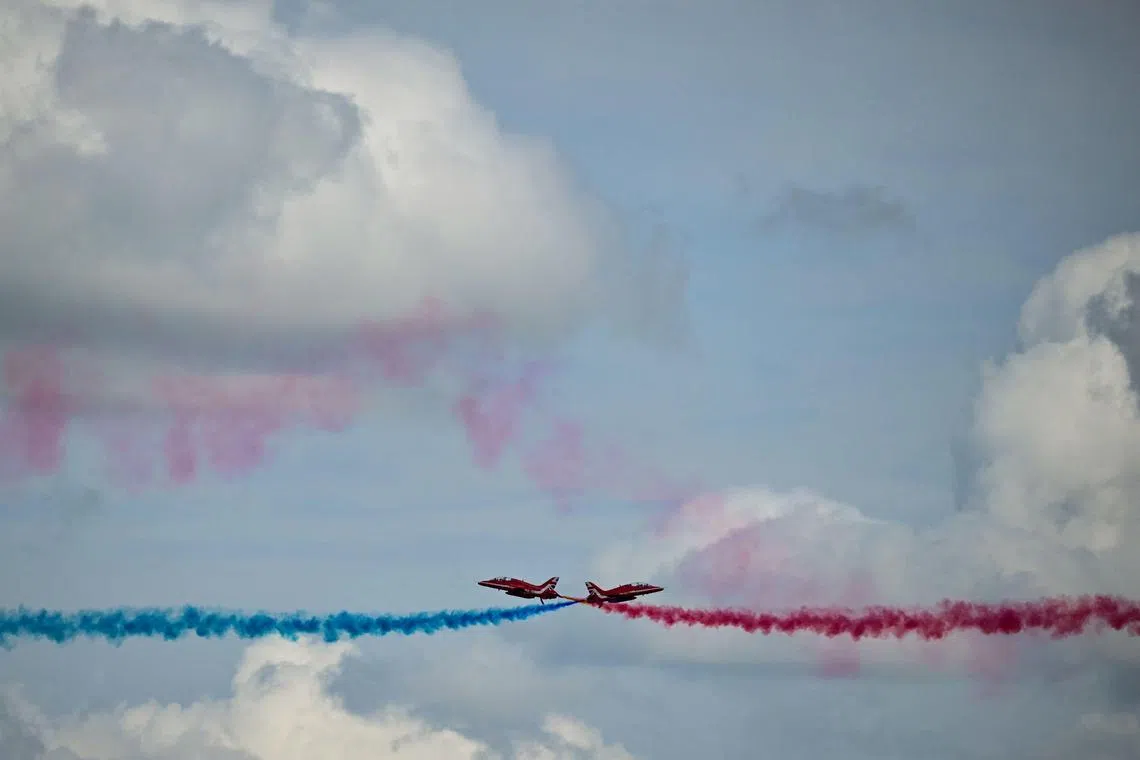 The British Royal Air Force's (RAF) aerobatic team, the "Red Arrows", performing a fly-past prior to the Formula One British Grand Prix at the Silverstone motor racing circuit in Silverstone, central England on July 9, 2023. 