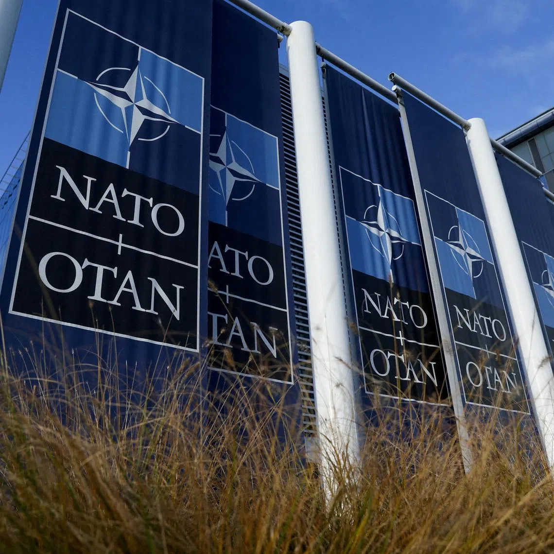 FILE PHOTO: Banners hang outside the NATO headquarters ahead of the a meeting of the alliance's foreign ministers, in Brussels, Belgium November 28, 2023. REUTERS/Yves Herman/File Photo