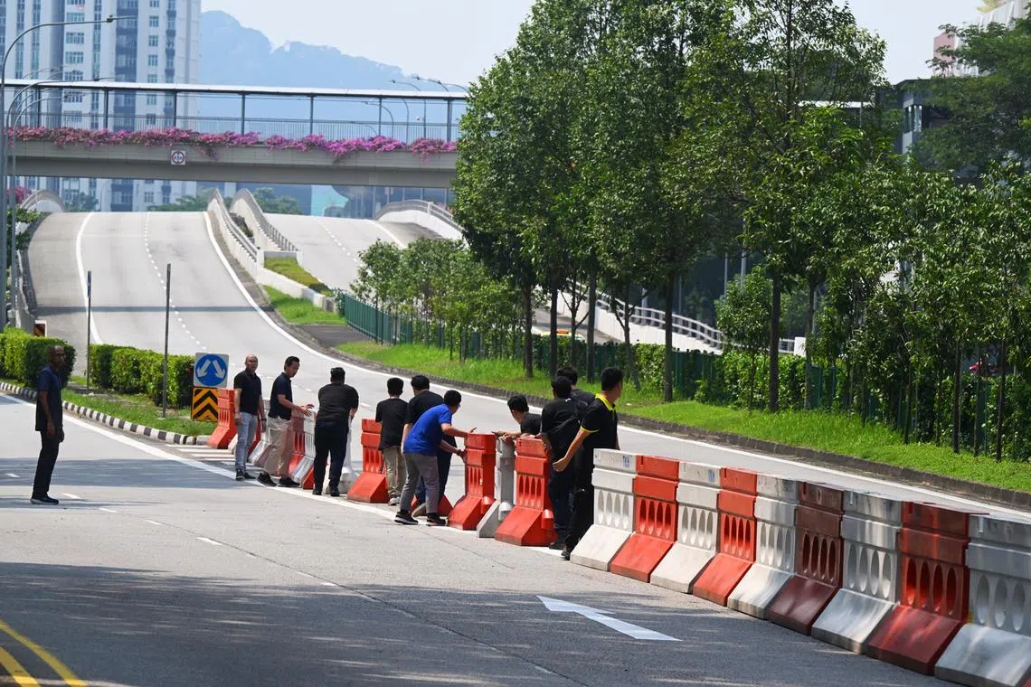 Barriers being set up at the start of the Bukit Panjang flyover at Woodlands Road at 11am on Sept 26. 