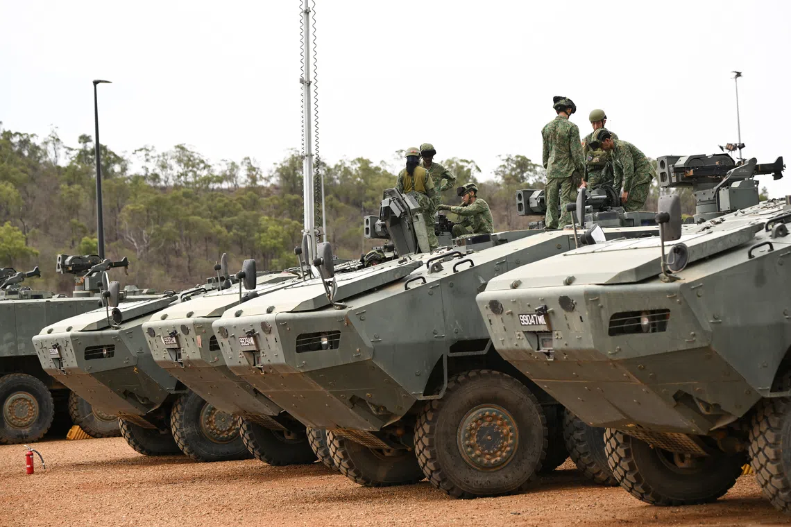 5 SIR personnel doing weapon checks on the Terrex Infantry Carrier Vehicles at Camp Tilpal in the Shoalwater Bay Training Area in Queensland, Australia on Oct 22.