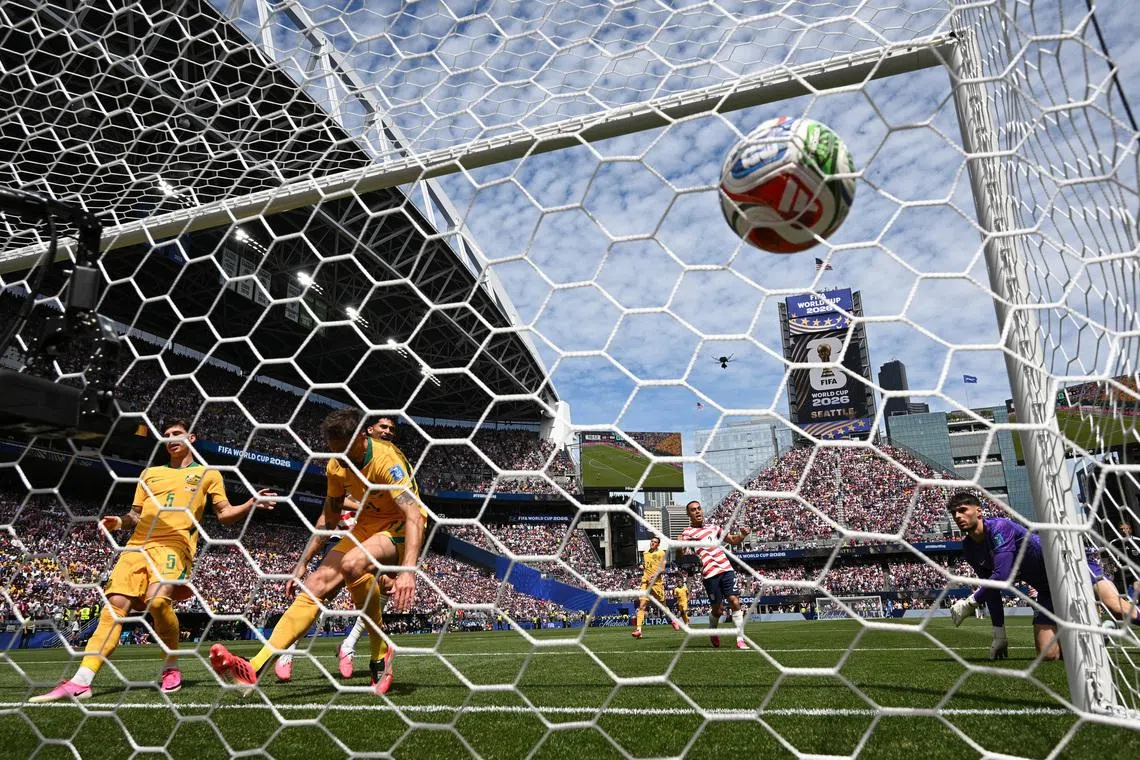 Australia's Cameron Burgess scores United States' first with an own goal.