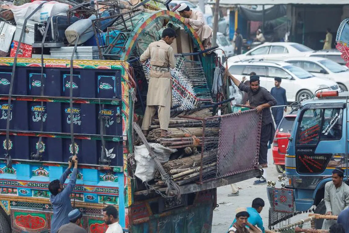 Afghan nationals set their belongings on a truck as they head back to Afghanistan, after Pakistan gives last warning to undocumented immigrants to leave, at the Torkham border crossing between Pakistan and Afghanistan, November 2, 2023. REUTERS/Fayaz Aziz