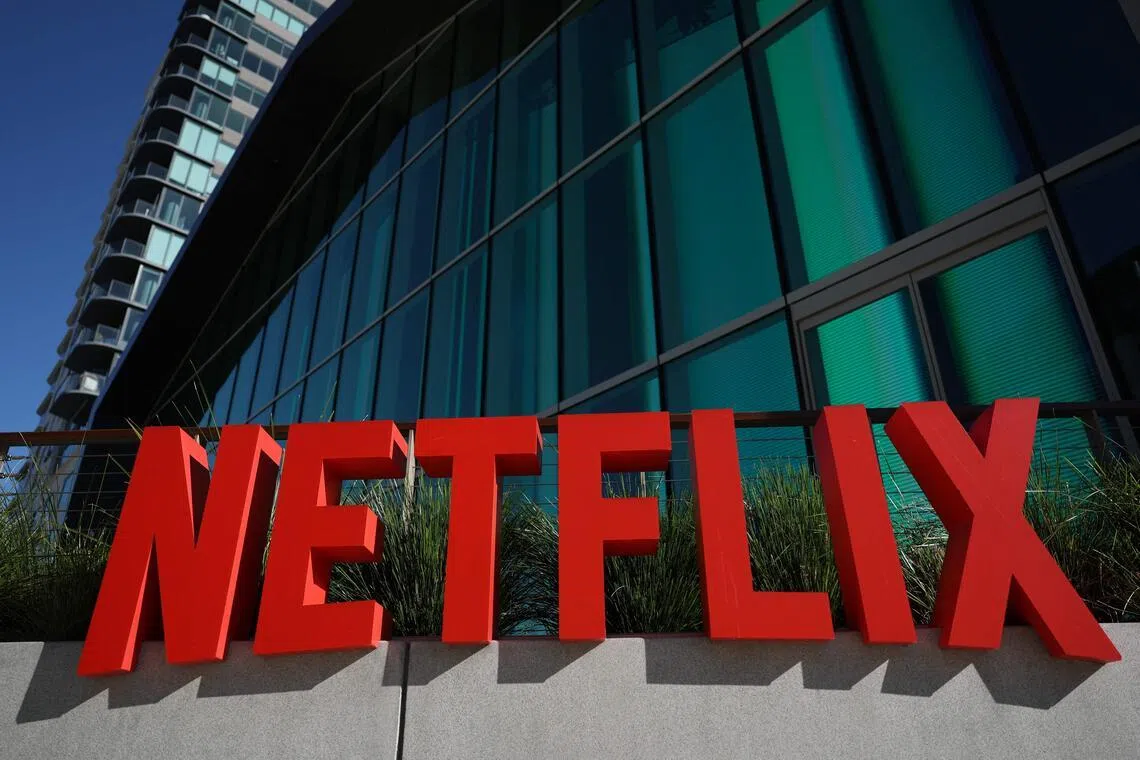 Netflix beats revenue estimates in holiday quarter; shares slide amid bidding war for Warner Bros