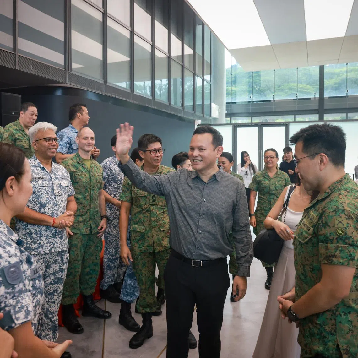 Senior Minister of State for Defence Zaqy Mohamad meeting SAF volunteers and regulars during the launch of the Singapore Defence Volunteer Network at the Central Manpower Base on May 12.