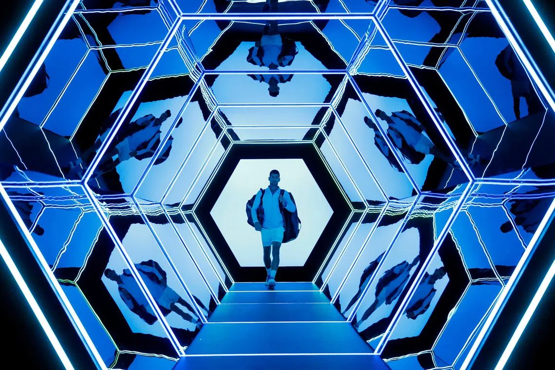 Serbia's Novak Djokovic walks out ahead of his round of 16 match against Russia's Karen Khachanov.