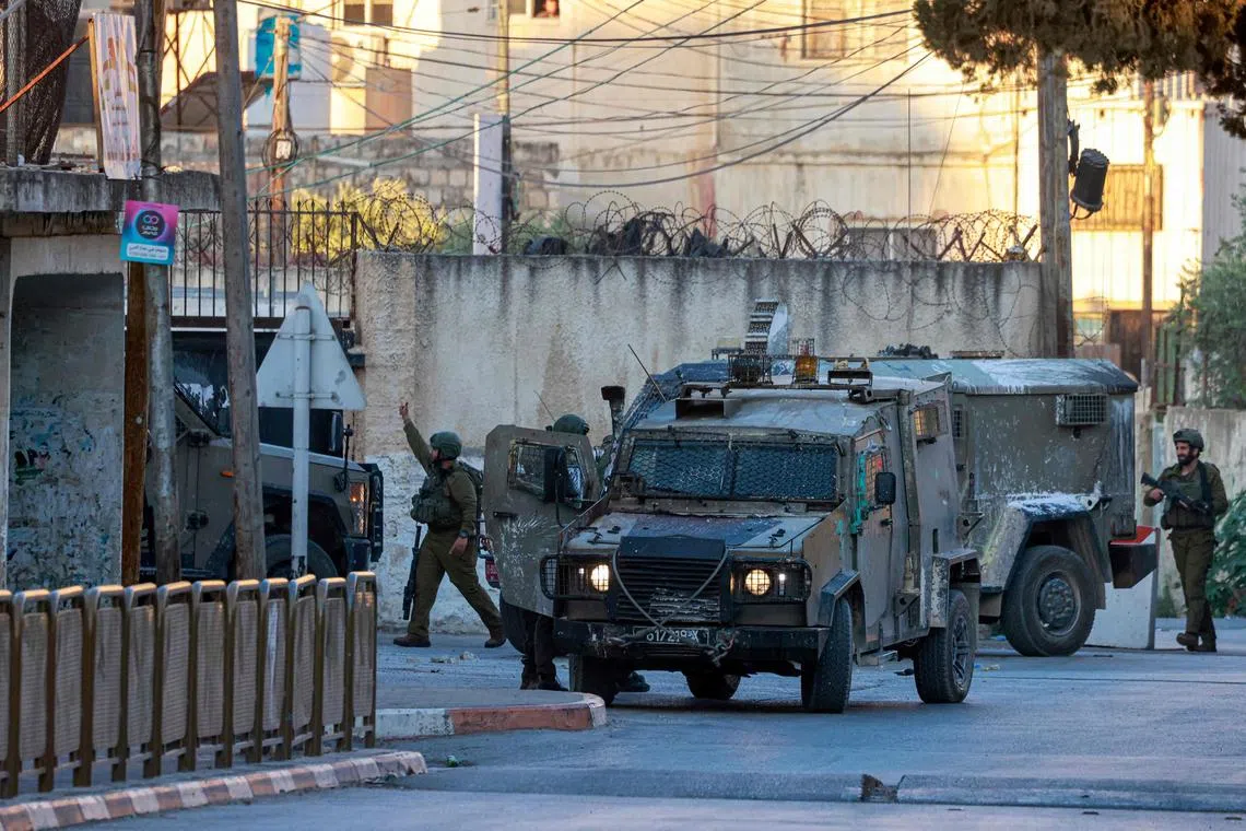 Israeli army forces deploy around the religious site of Joseph's Tomb in the occupied West Bank city of Nablus on June 27, 2025 after a group of Israelis entered the site without coordination with Palestinian security forces. 