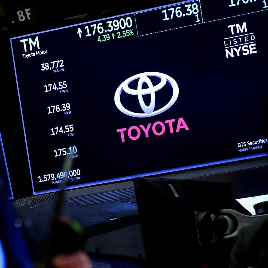 FILE PHOTO: Screens display the trading information and company logo for Toyota as a trader works on the floor at the New York Stock Exchange (NYSE) in New York City, U.S., April 15, 2025.  REUTERS/Brendan McDermid/File Photo