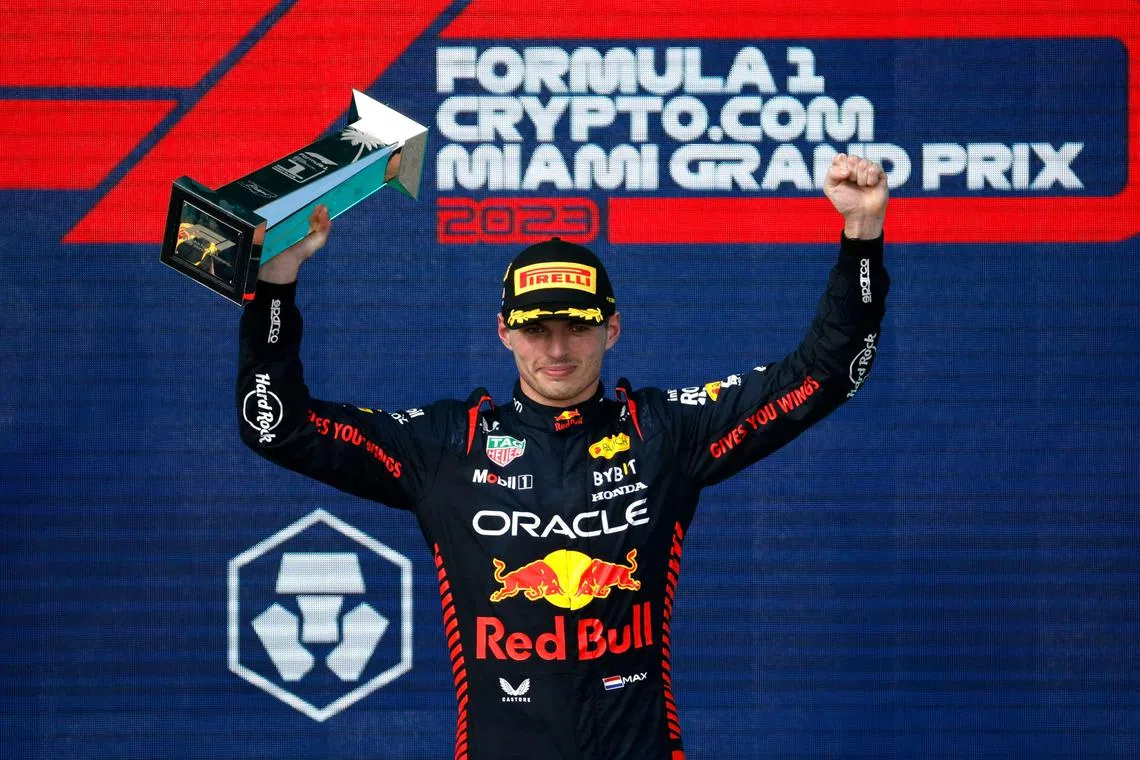 Max Verstappen celebrates on the podium after winning the Miami F1 Grand Prix on May 7, 2023.