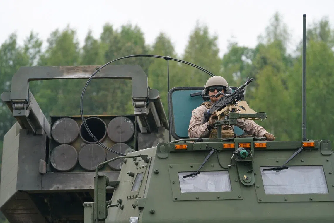 A U.S. soldier on task with a High Mobility Artillery Rocket System (HIMARS) during a live fire exercise with Lithuanian and U.S. troops at the annual naval military drills \"Baltops\" in Klaipeda, Lithuania, June 5, 2025. REUTERS/Janis Laizans