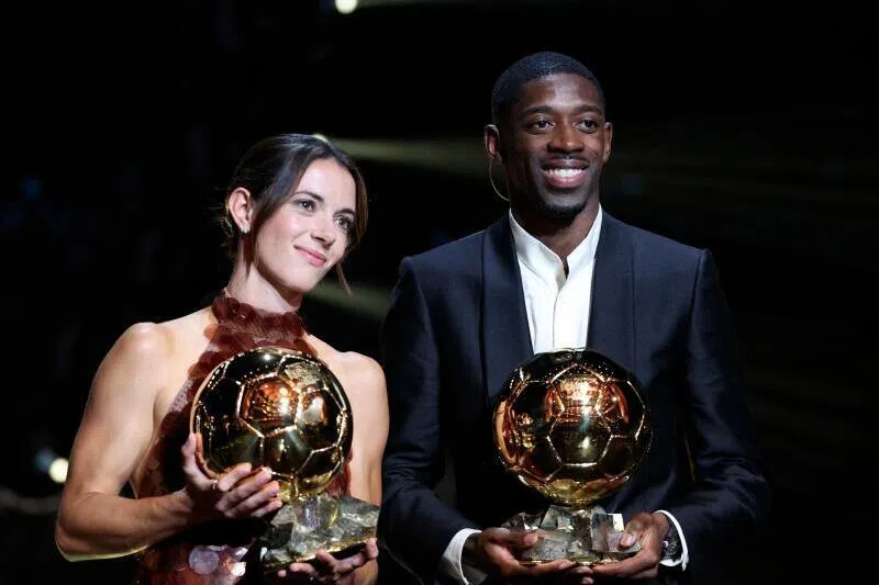 Paris Saint-Germain's French forward Ousmane Dembele and Barcelona's Spanish midfielder and Ballon d’Or 2024 winner Aitana Bonmati pose after receiving the awards.