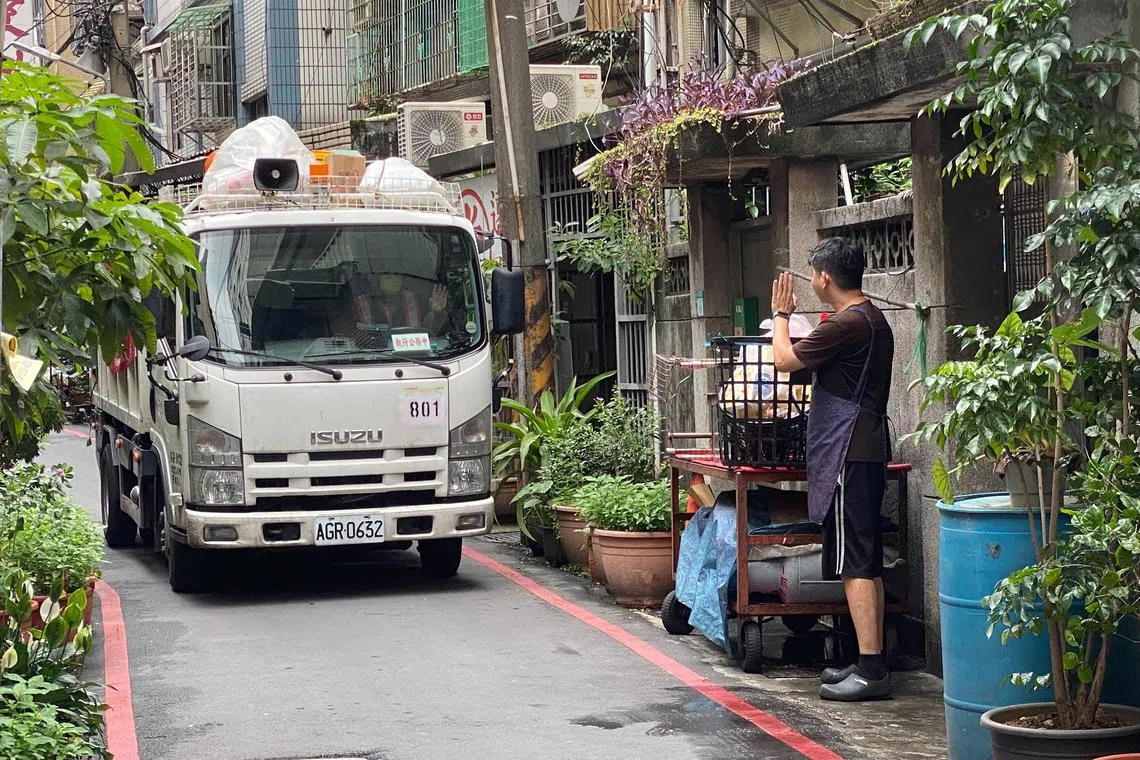 wyyletter31 - A resident waving to the driver of a recycling truck in Taiwan. 


Credit: Yip Wai Yee