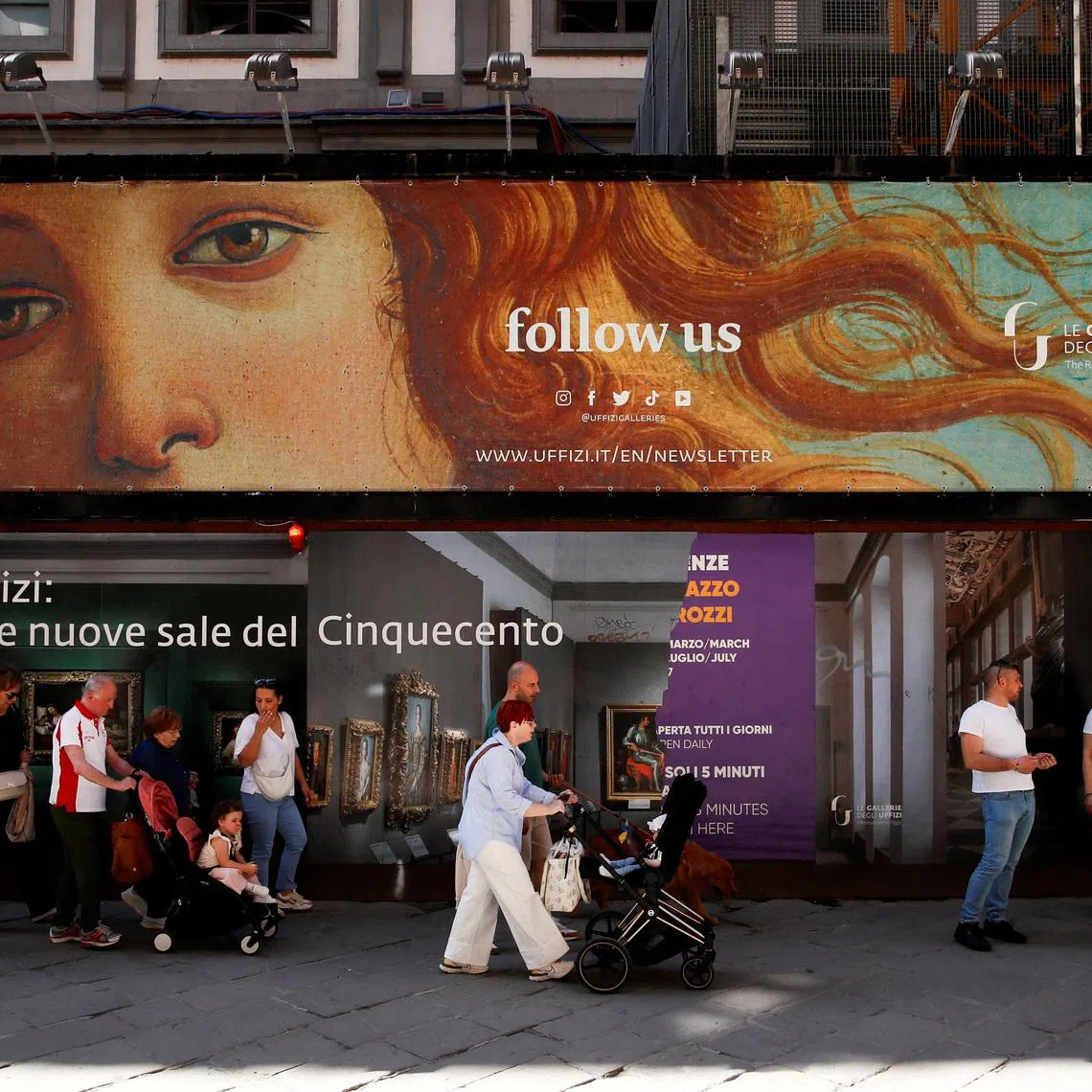 FILE PHOTO: People walk past the Uffizi Gallery Museum in Florence, Italy April 13, 2024. REUTERS/Alessandro Garofalo/File Photo