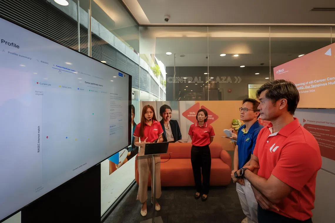 From right: 
Mr Desmond Tan, Deputy Secretary-General, National Trades Union Congress (NTUC), and Senior Minister of State, Prime Minister's Office, Deputy Secretary-General, National Trades Union Congress (NTUC); 

and Mr Desmond Choo, Mayor of North East District, and Assistant Secretary-General, NTUC; 

being given a demonstration of the AI-powered Virtual Career Coach (VCC) at the e2i Career Centre at ServiceSG Centre at Our Tampines Hub on Oct 4, 2024.