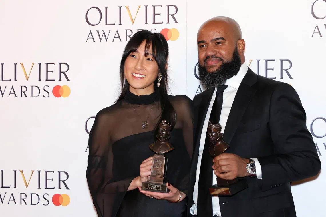 Jessica Hung Han Yun and Tony Gayle pose with the awards for Best Lighting and Best Sound Design for RSC'S My Neighbor Totoro at the Olivier Awards at the Royal Albert Hall in London on April 2, 2023. 