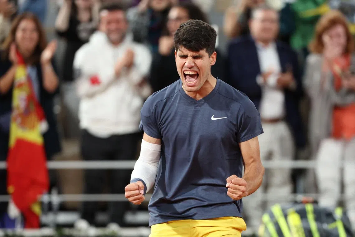 Spain's Carlos Alcaraz celebrates after winning his quarter-final match against Greece's Stefanos Tsitsipas.