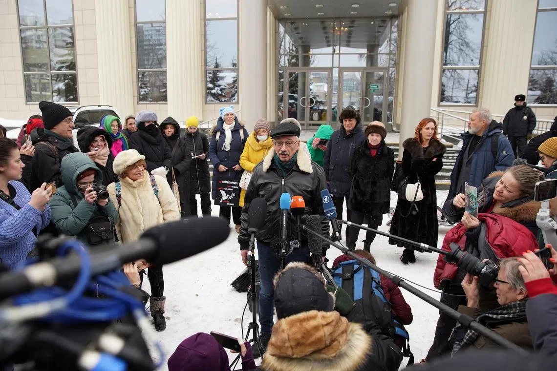 Russian veteran human rights campaigner Oleg Orlov speaks to journalists after an appeal hearing in Moscow, Russia December 14, 2023. Orlov appealed against a court ruling that found him guilty of discrediting the Russia's armed forces, and the prosecutor's office filed a counter-appeal, demanding a prison sentence for him. REUTERS/Tatyana Makeyeva/File Photo