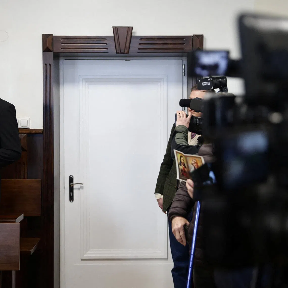Poland's Catholic diocese of Tarnow Bishop Andrzej Jez stands at a district court before the start of his trial on charges of failing to promptly inform law enforcement about alleged child abuse committed by priests under his authority, in Tarnow, Poland, February 18, 2026. Jakub Wlodek/Agencja Wyborcza.pl/via REUTERS