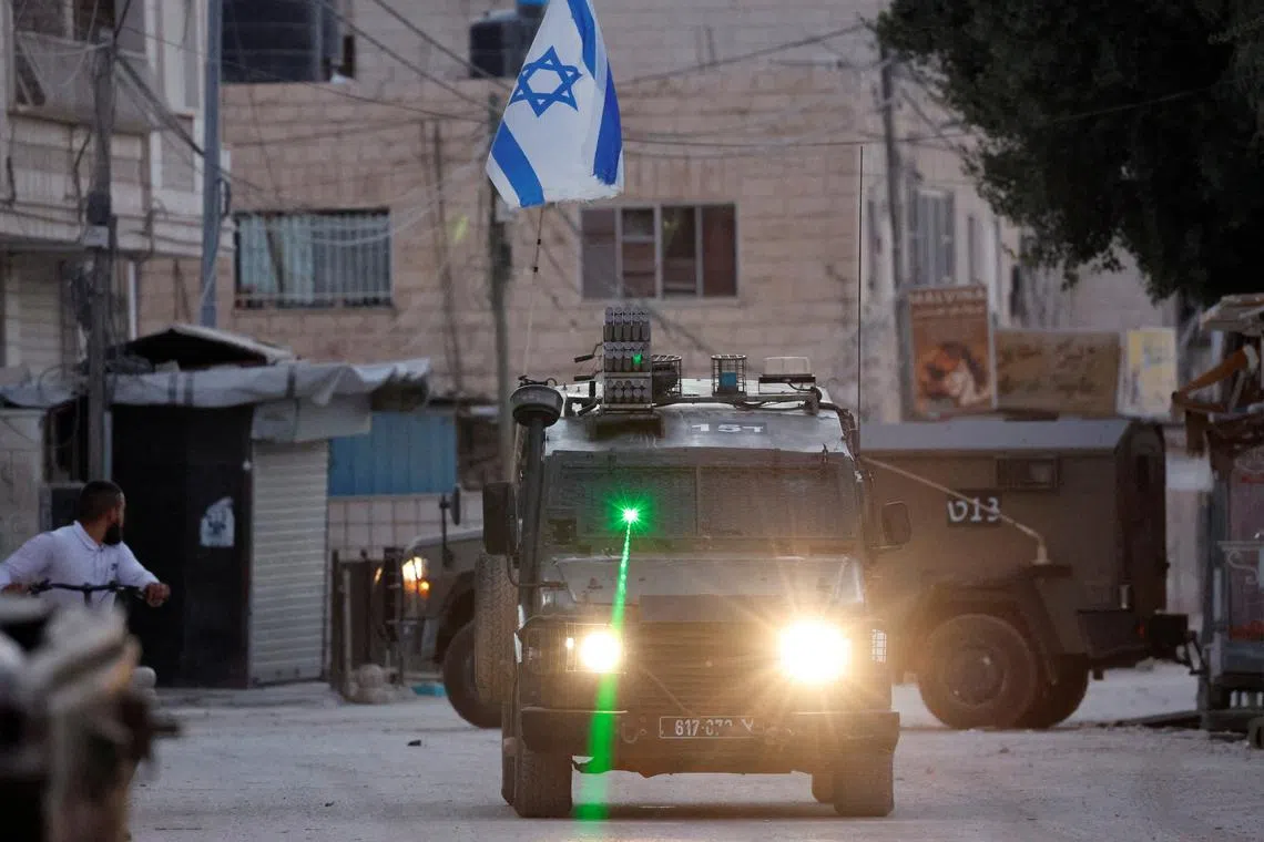 A military vehicle with a laser transits during an Israeli raid in Jenin, in the Israeli-occupied West Bank, September 25, 2024. REUTERS/Raneen Sawafta/File Photo