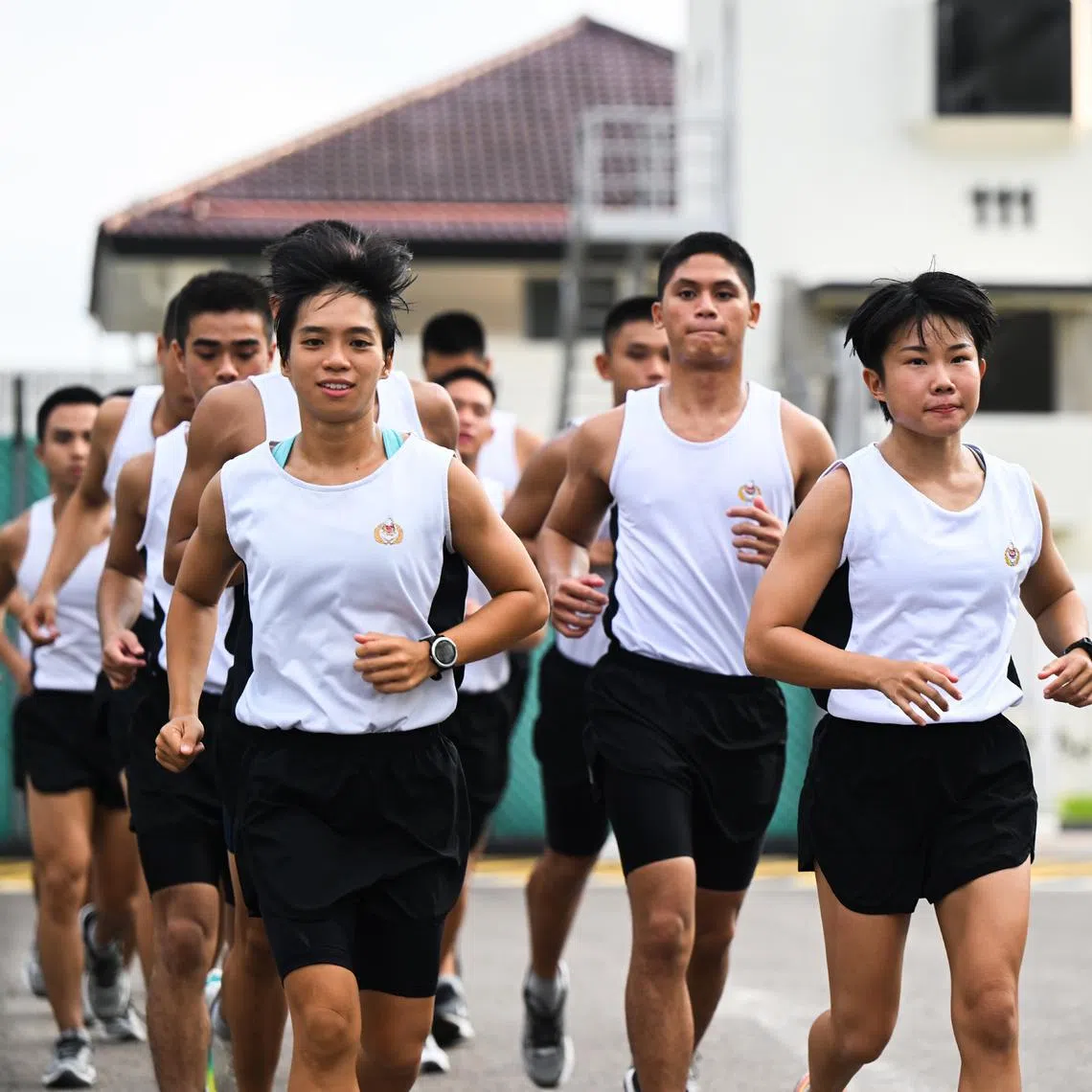 Captain Angelia Tan (left) and Capt Jhosy Ng graduated from the 60th edition of the course along with 68 other male trainees.