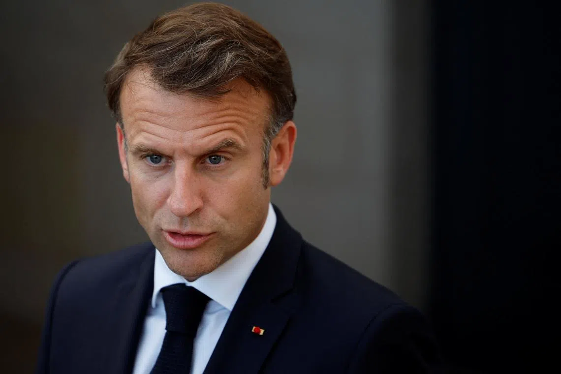 French President Emmanuel Macron speaks to the media, on the first day of the G7 summit, in Savelletri, Italy, June 13, 2024. REUTERS/Louisa Gouliamaki